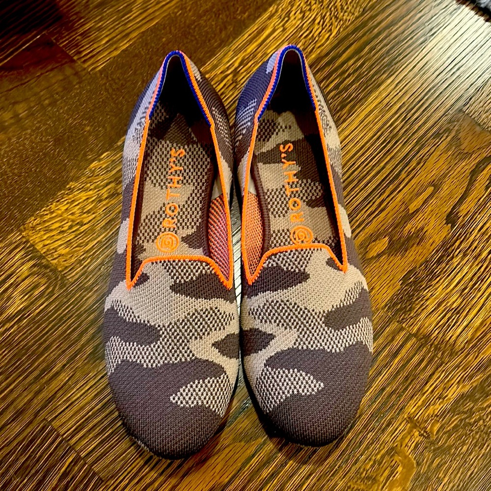 Beige camo Rothy loafers with orange trim.